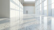View from an oblique angle of an empty room with terrazzo flooring and high ceilings, natural light casting soft shadows