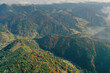 © New Africa - Aerial view of beautiful mountain forest and village on autumn day