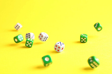 Canvas Print - Many color game dices falling on yellow background