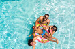Diverse family enjoys a sunny day in the pool