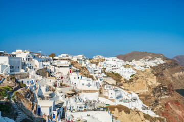 Poster - Famous Santorini island bell towers against Oia village. Greece