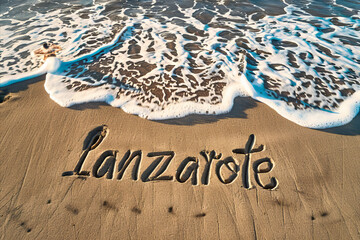 Lanzarote, Spain written in the sand on a beach. Spanish tourism and vacation background