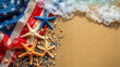 © Ayesha - Labor Day with flag, white, blue and red stars and starfishes on the sandy beach - USA holidays concept