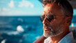 Nautical Upper class Bliss: Middle-Aged Man with Sunglasses  Enjoying Summer Vacation on His Yacht, Basking in the Sunlight of Open Sea.