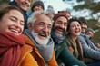 © Iigo - Group of friends having fun together in the park. Cheerful senior men and women bonding outdoors.