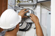 Electrician is repairing and checking electric meters. Close up. Selective focus.