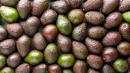 Wall Mural - Top view full frame of whole ripe brown avocados placed together as background . Generative Ai