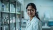 © STOCKYE STUDIO - woman, wearing a lab coat, standing in a clinical lab