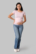 © Pixel-Shot - Happy young pregnant African-American woman on grey background