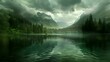 Dark green lake, forest and mountains in the background, cloudy sky