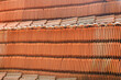 Red clay roof tiles for vintage looking house made of natural eco friendly building material.  Clay tile factory located at Kozhikode, Kerala, India