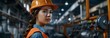 © pisan thailand - Skilled Female Construction Worker in Uniform Overseeing Industrial Factory with Machinery and Equipment