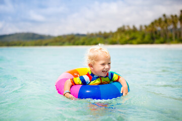 Canvas Print - Child on tropical beach. Sea vacation with kids.