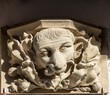 Stone head, pieces from the facade of neo-gothic New Cathedral, Linz, Austria