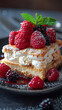 delicious cake with raspberries and cream on plate