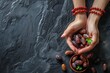 Ramadan Kareem background concept, Hands holding rosary bead with dates fruit and milk on dark stone background