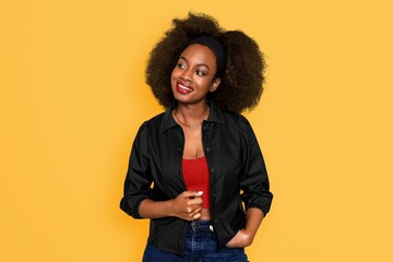 Wall Mural - Beautiful black woman isolated on yellow background