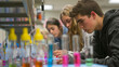 A group of chemistry students conducting a lab experiment on chromatography, separating and analyzing mixtures of compounds to identify their components.