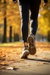 © Stavros - Jogging workout in autumn forest. Man during jogging workout in an autumn city park. Keeping fit in any age. Male legs close-up.