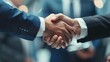 © Rasheed - Close-up of a handshake between business partners