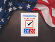 Part of the American flag with Presidential election 2028 text on white paper over a vintage background.