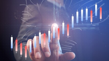 Poster - A businessman points a finger with a light point at the center of the coordinate system against the background of a chart of growing blue and red Chinese candlesticks, which characterizes success. Cg