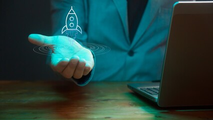 Poster - Above the male open palm is a symbolic image of a rocket flying upward. Concept of modern startup and financial success. Cg