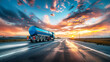 A blue tanker truck speeds down the highway at sunset, transporting industrial petroleum products for delivery