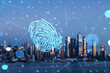 Double exposure of a fingerprint hologram over a New York cityscape at dusk. Digital security and identity verification concept. Double exposure