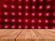 perspective wooden board over blurred red electric light