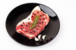 raw beef, black papper, gralic and rosemary for steak on white background