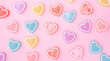 Colorfully heart jelly on a pink background.