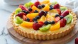 A delicious looking fruit pie with a variety of fruits including strawberries