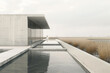 Minimalist modern museum exterior with reflective water feature