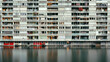 Symmetrical view of Scandinavian apartments by water