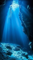 Wall Mural - A deep blue cave with sunlight shining through the entrance