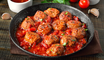 Wall Mural - Meatballs with parsley in frying pan