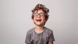 © Simon C - Kid laughing on plain background
