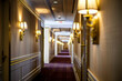 Grand hotel hallway captured in reflection, accented with golden sconces and burgundy carpets.