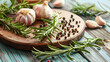 Board with fresh rosemary garlic and peppercorns