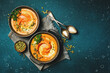 Two bowls of pumpkin soup. Pumpkin Autumn Healthy Food Nutrition Seasonal Vegetable Concept. Autumn vegetables. Top view.