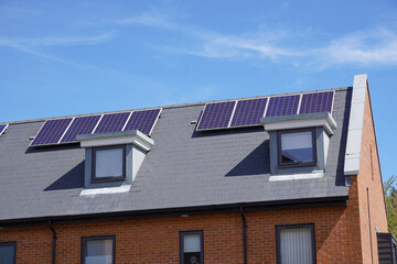 solar panels on roof of residential building. alternative energy source for homes 