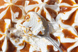 Tasting the vanilla ice cream with caramel. The metallic spoon with piece of cold dessert. Closeup view from above.