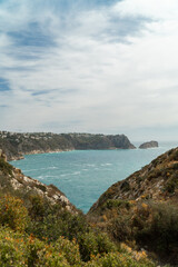 Wall Mural - Panoramic view, cliffs and Mediterranean sea on a cloudy morning day, in Jávea, Alicante (Spain).