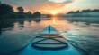 A close-up of a paddleboard on calm lake waters at dawn.