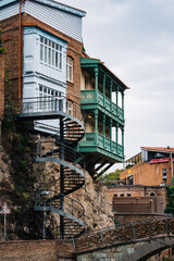 Wall Mural - Spiral staircase going from traditional Georgian houses with carved wooden balconies to the Leghvtakhevi Canyon in Tbilisi old town, Kala (Georgia)