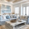 Show a minimalist coastal style living room with white and soft blue decor, emphasizing open space and natural lighting.