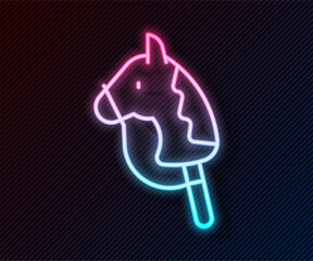 Wall Mural - Glowing neon line Toy horse icon isolated on black background. Vector