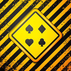 Canvas Print - Black Deck of playing cards icon isolated on yellow background. Casino gambling. Warning sign. Vector