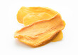 Slices of large sweet dried mangoes on white background.